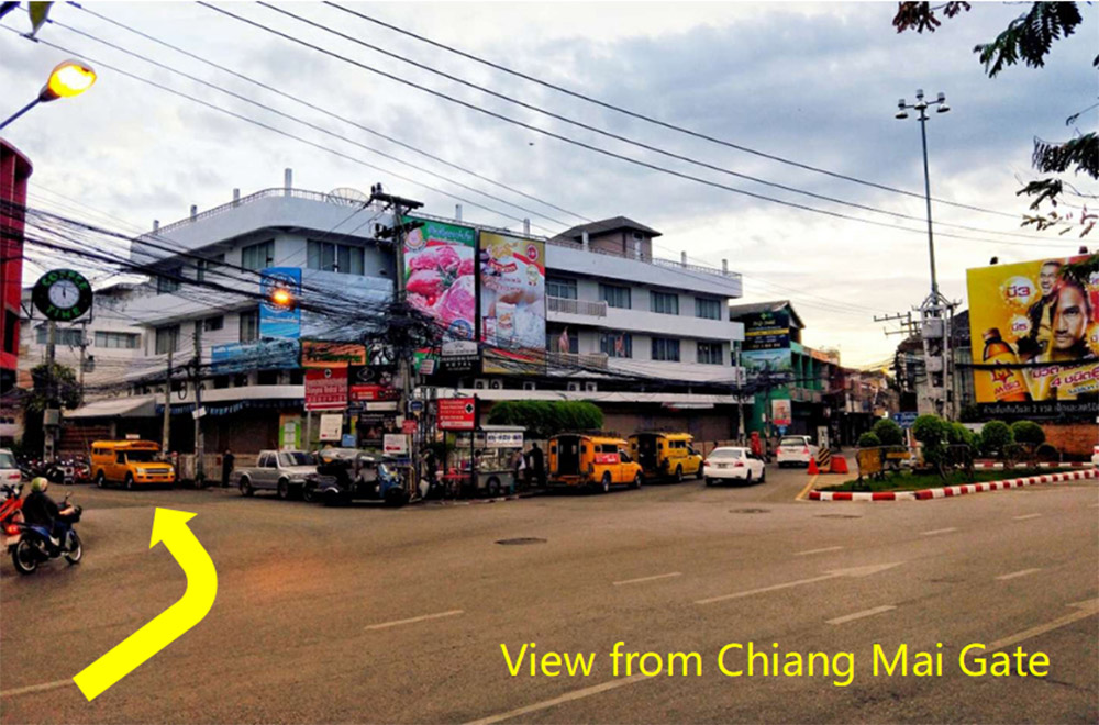 View from Chiang Mai Gate showing the street leading to Aloha Massage — follow the arrow to reach our sensual massage shop.